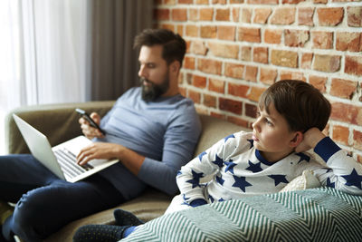 Boy using laptop at home