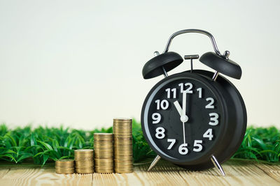 Close-up of clock on table
