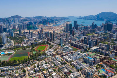 High angle view of city buildings against sky