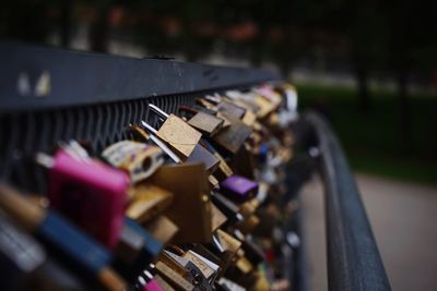 Close-up of padlocks on railing