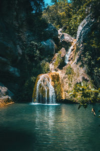 Scenic view of waterfall in sea