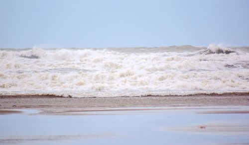 Scenic view of beach against clear sky