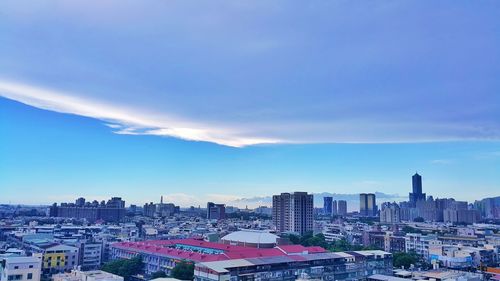 Cityscape against blue sky