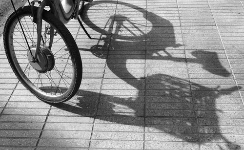 Shadow of man on bicycle