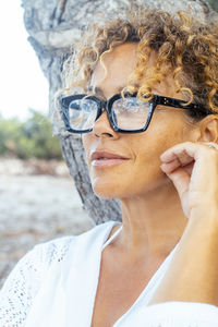 Portrait of young woman looking away