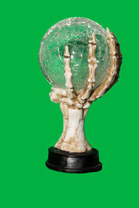 Close-up of electric lamp against green background