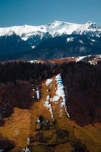 High angle view of townscape and mountains against sky