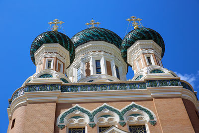 Low angle view of building against blue sky