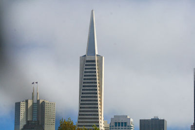 Modern buildings in city against sky