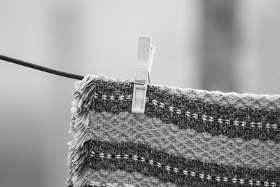 Close-up of clothespins on rope