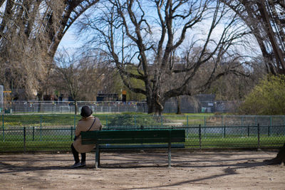 Man sitting on seat in park