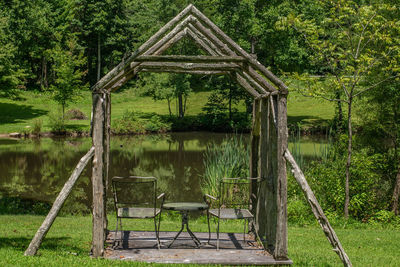 Built structure in lake with trees in background