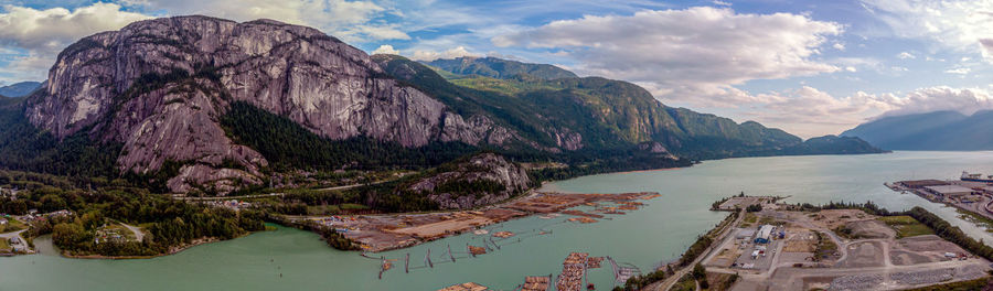 Panoramic view of mountain range against cloudy sky