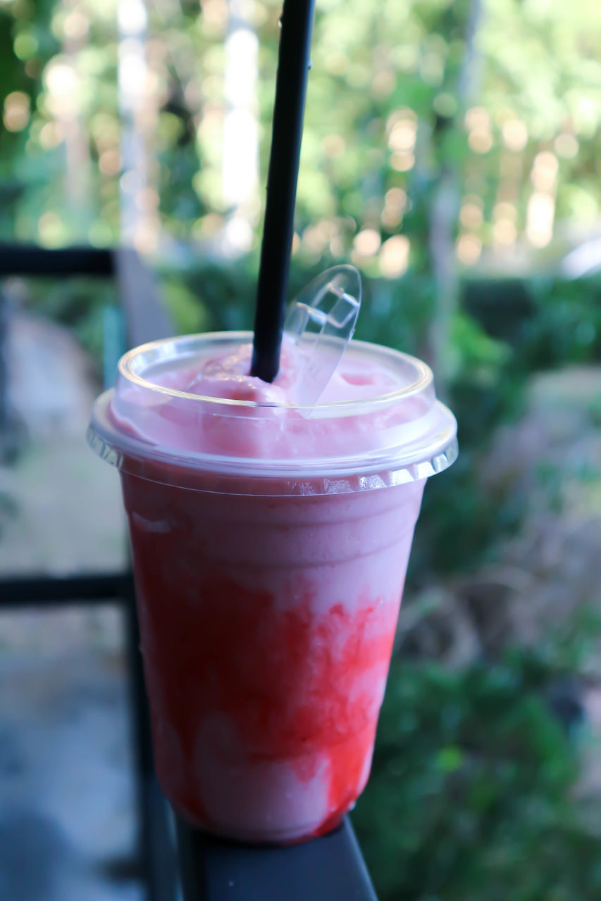 CLOSE-UP OF GLASS OF JUICE