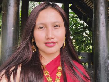 Close-up portrait of a smiling young woman