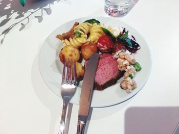 High angle view of fruit salad in plate on table