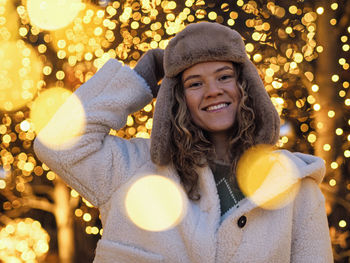 Portrait of young woman with balloons