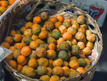 High angle view of oranges for sale in container