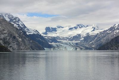 Scenic view of lake with mountains in background