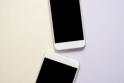 Close-up of smart phone over white background