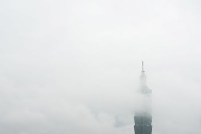 Low angle view of buildings in city against sky