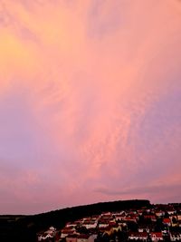 Aerial view of townscape against sky during sunset