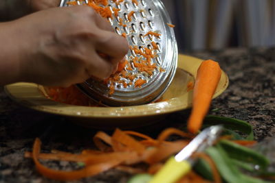 Close-up of person preparing food