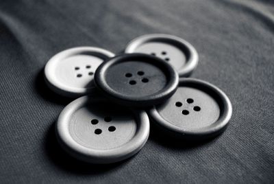 Sewing buttons on fabric