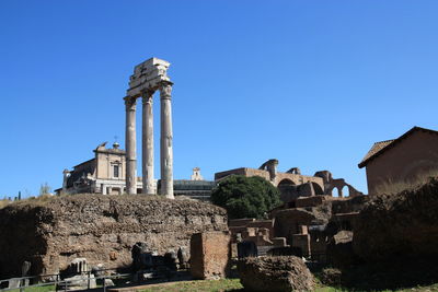Low angle view of building against clear blue sky