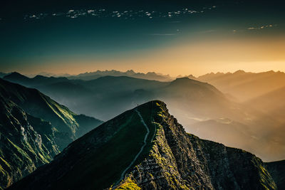 Scenic view of mountains against sky during sunset