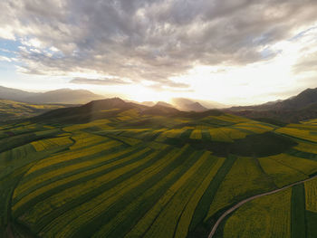 Aerial view of agricultural field against sky