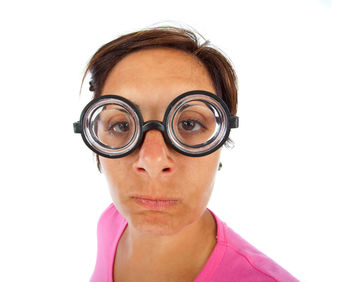 Portrait of a woman wearing mask against white background