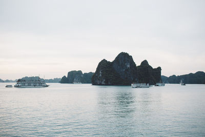 Ships sailing on sea against sky