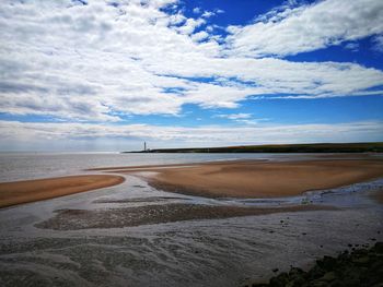 Scenic view of beach against sky