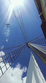 Low angle view of windmill against blue sky