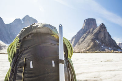 Rear view of backpacker exploring remote mounaitn range.