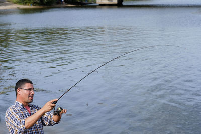 Man fishing in lake