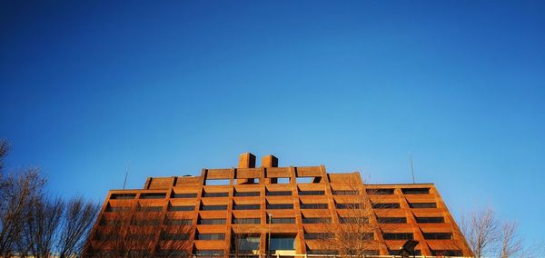 Low angle view of building against blue sky