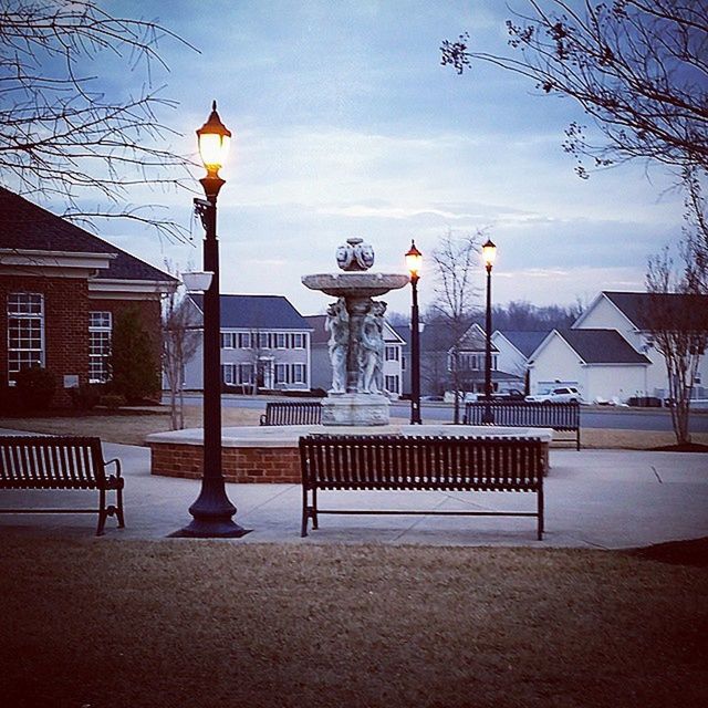 architecture, built structure, building exterior, sky, street light, lighting equipment, empty, city, railing, tree, street, cloud - sky, cloud, outdoors, absence, house, lamp post, incidental people, no people, bench