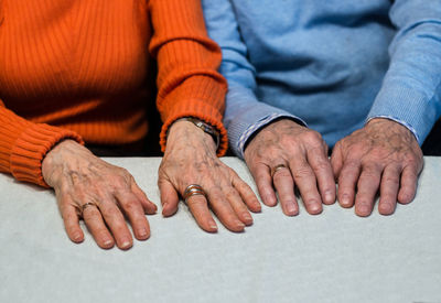 Close-up of people on table