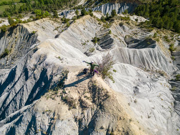 Rear view of man climbing on mountain