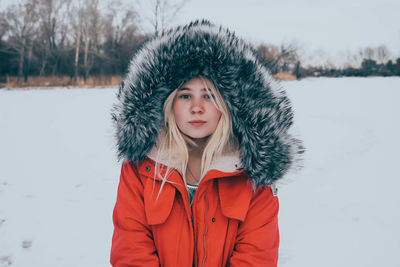 Young woman in snow covered landscape