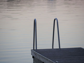 Close-up of pier over lake