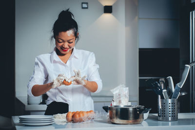 Woman holding food on table