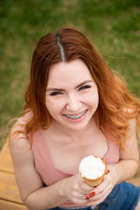 High angle view of woman eating ice cream