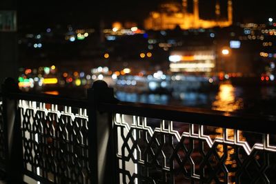 Railing of balcony in city at night