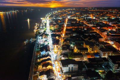 High angle view of illuminated buildings in city at night