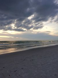 Scenic view of beach against sky during sunset