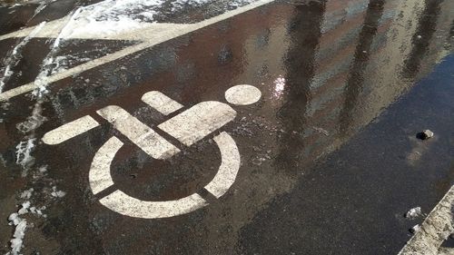 High angle view of road sign on street