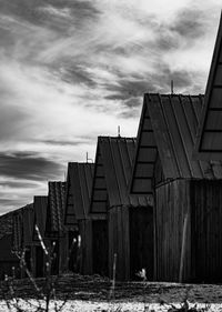 Old building by city against sky